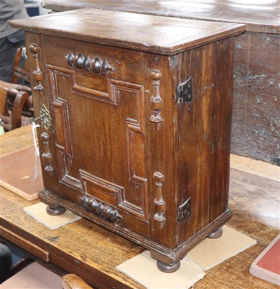A Charles II oak spice cupboard, W. 1ft 5in. D. 9.5in. H. 1ft 7in.